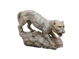 marble statue of a cat on a rock on a white background