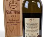 a bottle of wine that is next to a wooden box