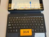 a laptop computer sitting on a table with a price tag on it