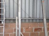 two ladders leaning against a wall in a building