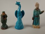 three figurines that are sitting next to each other