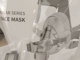 a picture of a face mask in a package on a table
