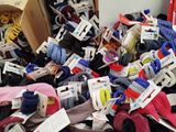 many pairs of shoes and socks in a box