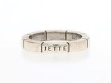 a close up of a silver ring with a name engraved on it