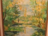 tableau représentant un tableau représentant une rivière avec des arbres en arrière-plan
