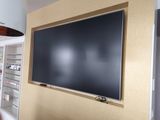 a large flat screen tv mounted on the wall in a room