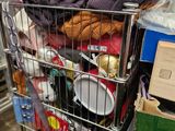 a shopping cart full of clothes and other items