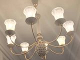 a chandelier that is hanging from the ceiling in the room