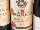 several bottles of wine are lined up on a table