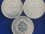 three silver coins with the names of france, france and france on them