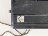 a close up of a black case with a key on it