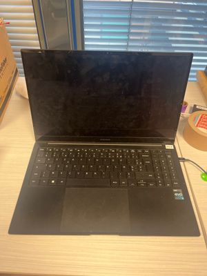 a laptop computer that is sitting on a desk