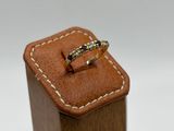 a close up of a ring sitting on top of a wooden box