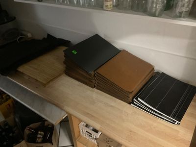 a stack of books sitting on top of a wooden table