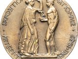an image of a bronze medal with a man and woman on it