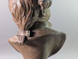 a statue of a man with a beard on a pedestal