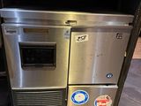 a stainless steel oven sitting in the middle of a kitchen