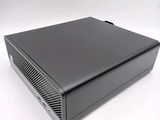 a close up of a small black computer on a white surface