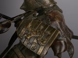 a statue of a man with a sword on a horse