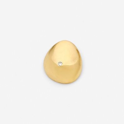 a close up of a gold ring with a diamond in the center