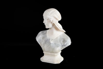 marble bust of a woman with a turban on her head