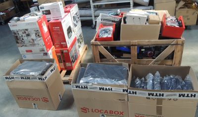 several boxes of electronics are stacked on top of each other in a warehouse