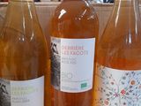 several bottles of wine are lined up on a table