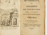 un vieux livre sur lequel est posée la photo d'un homme