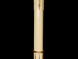 an image of a white candle with a gold decoration on top of it