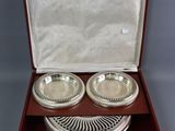 pair of silver plated dishes in a wooden box