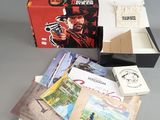 the contents of a box of cards and a box of books