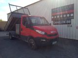 a red truck that is parked in front of a building
