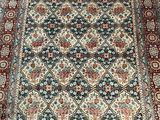 an oriental rug on a wooden floor in a room