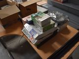 a pile of boxes sitting on a table in a room