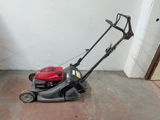 an image of a lawn mower on the ground