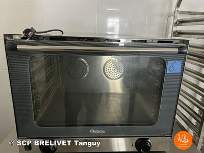 a toaster oven sitting on a counter in a kitchen