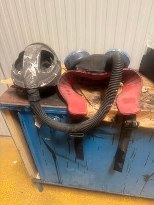 a blue cabinet with a pair of shoes and a mask on it