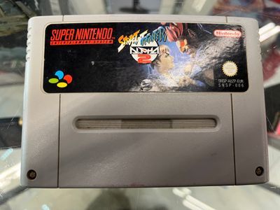 an old nintendo game on display in a glass case