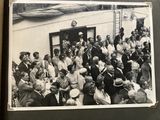 a black and white photo of a crowd of people