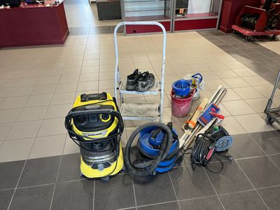 a picture of a vacuum cleaner and other cleaning equipment on the floor