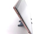 a tablet that is sitting on a stand on a table