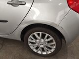 a silver car that is parked in a garage