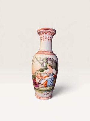 a vase with a painting on it sitting on a table