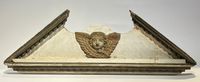 Dessus de porte de boiserie figurant une tête d'angelot et f…