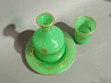 two cups and a saucer sitting on a table