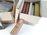 many books that are in a box on the table