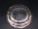 a silver plate that is sitting on a table