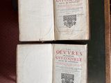 two open books sitting on top of a table