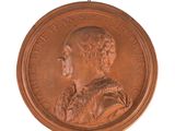 une image représentant une médaille de bronze sur laquelle figure le profil d'une femme