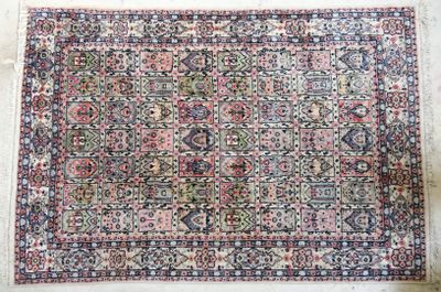 an antique persian rug on display in a museum